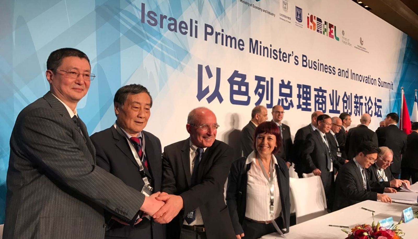 Wahaha Chairman and CEO Zong Qinghou, left, and University of Haifa President Ron Robin, third from left, at the signing. Photo: courtesy