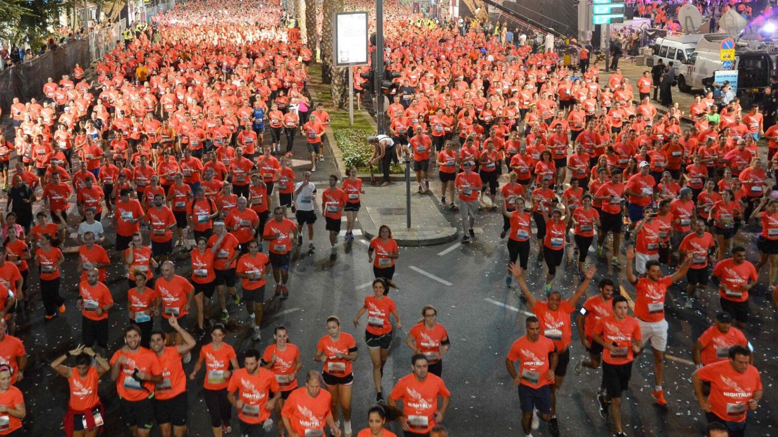 Because people here love sports. Runners set off on the Tel Aviv Night Run. Photo courtesy of Tel Aviv municipality