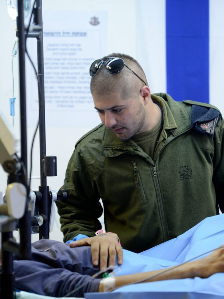 An IDF medic treats an injured Syrian in northern Israel. Photo by Government Press Office