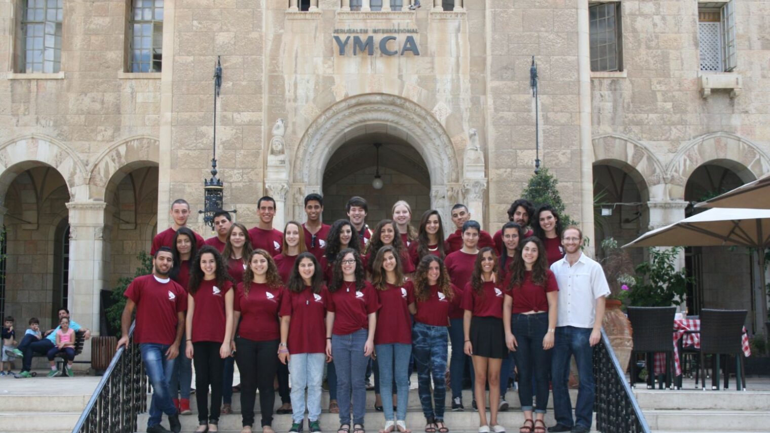 Members of the Jerusalem Youth Chorus in front of their home base, the International YMCA in Jerusalem. Photo: courtesy