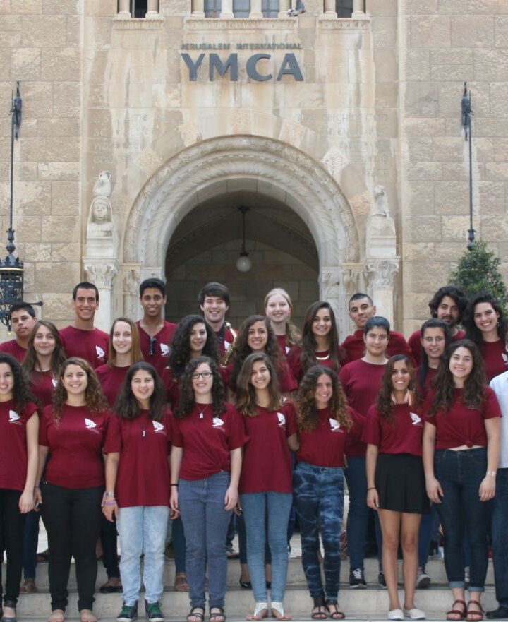 Members of the Jerusalem Youth Chorus in front of their home base, the International YMCA in Jerusalem. Photo: courtesy