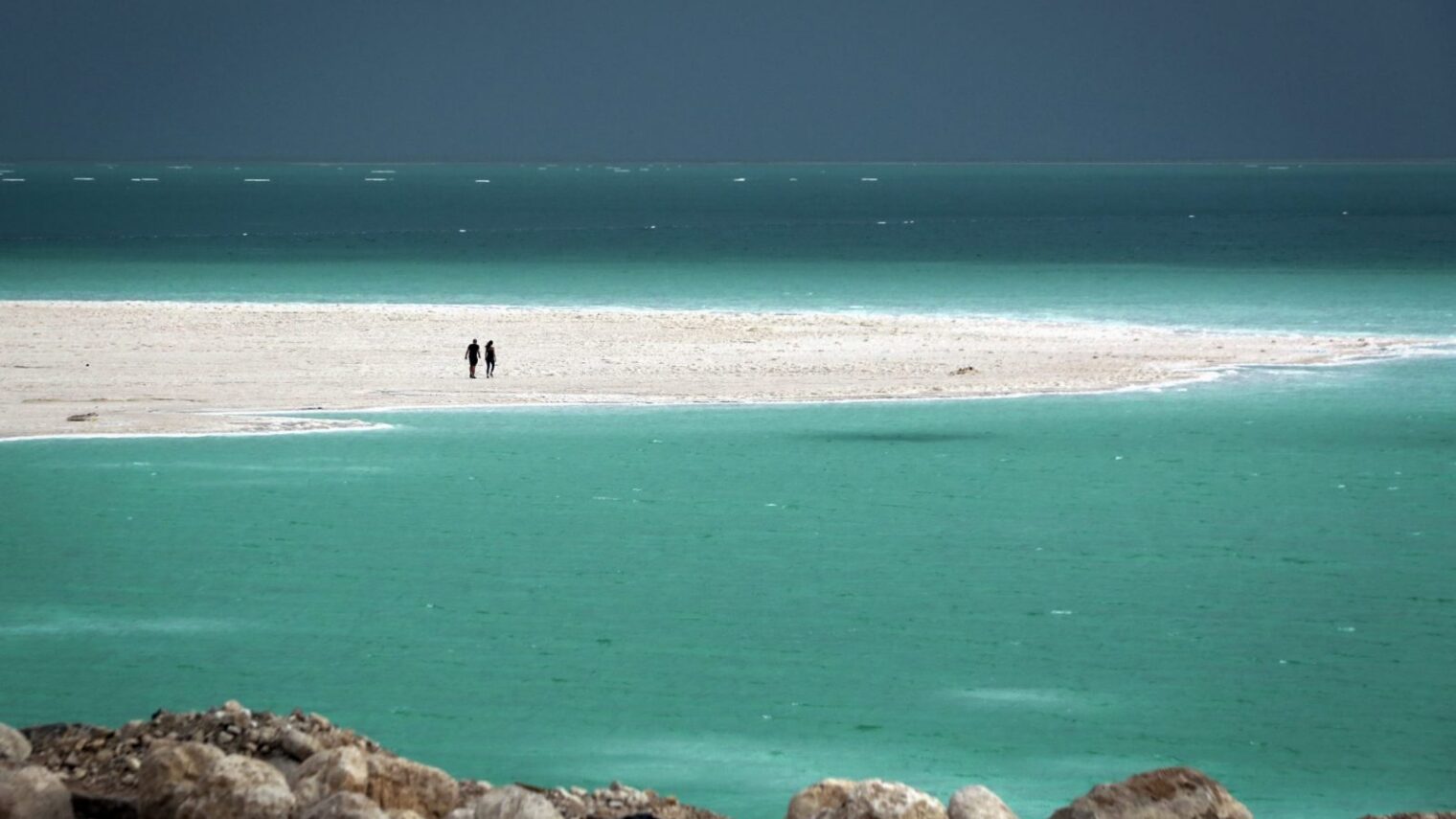 Because Israel is beautiful. A couple walk on a beach at the Dead Sea. Photo by Yossi Zamir/FLASH90