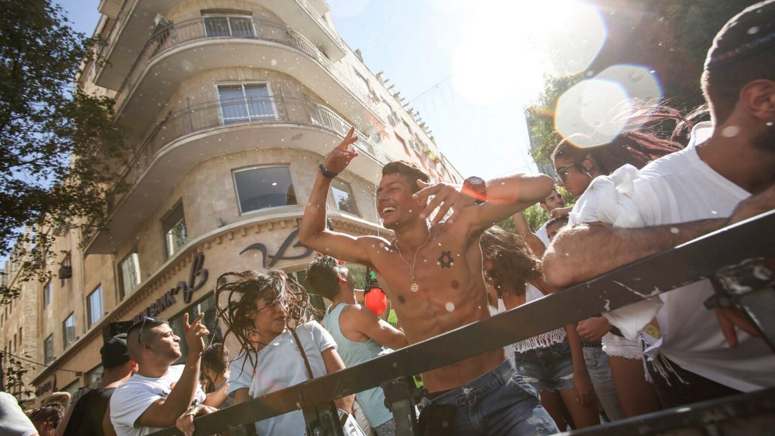 Because people in Israel know how to party. Israelis enjoy dancing at a party in Ben Yehuda Street in Jerusalem. Photo by Shlomi Cohen/FLASH90