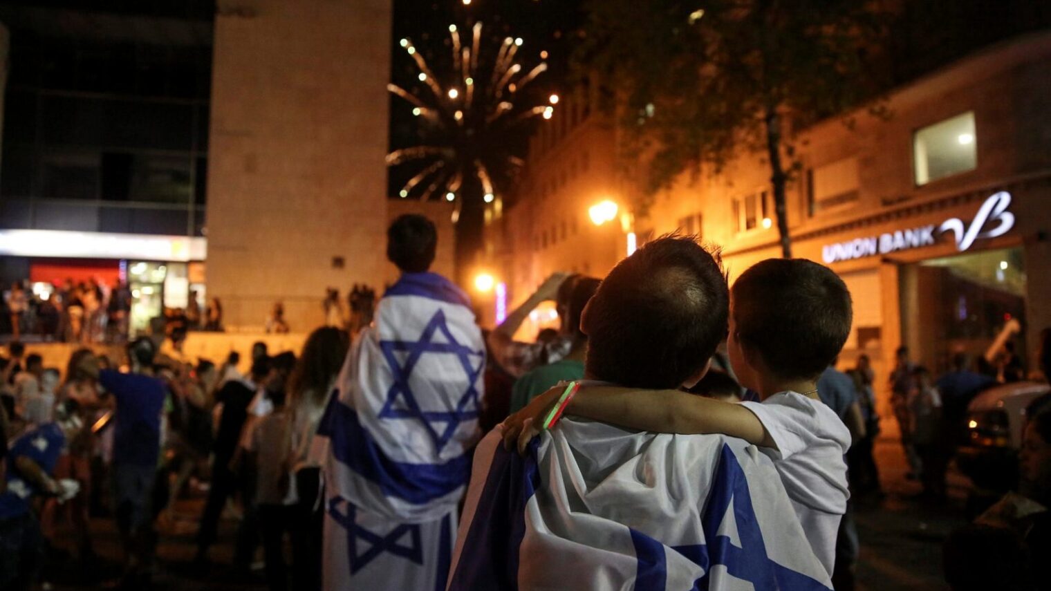 And last, but not least, because it’s our home. Israeli families watch fireworks on Independence Day in Jerusalem. Photo by Hadas Parush/FLASH90