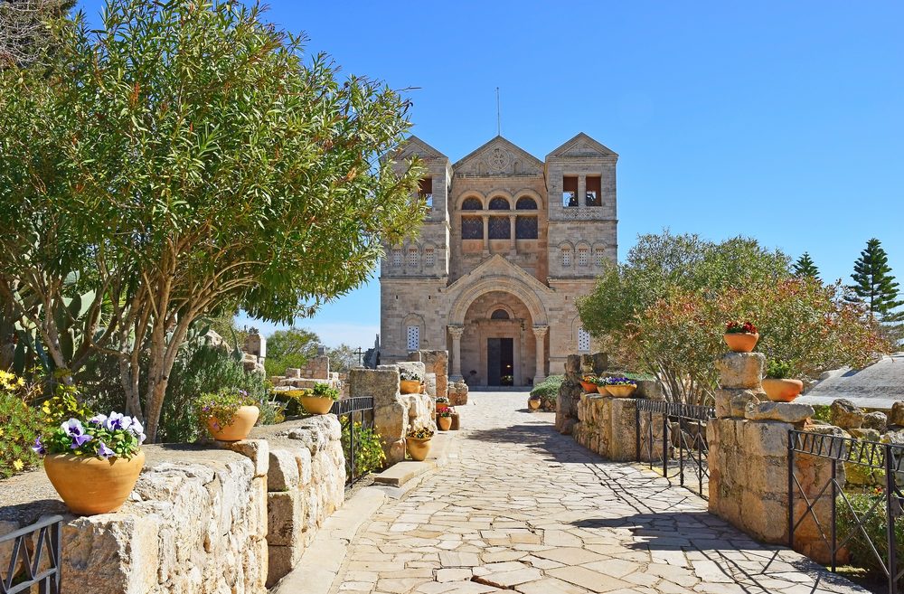 Because we have beautiful churches and monasteries. The entrance to the Church of the Transfiguration in Mount Tabor in the Galilee. Photo by Shutterstock.com