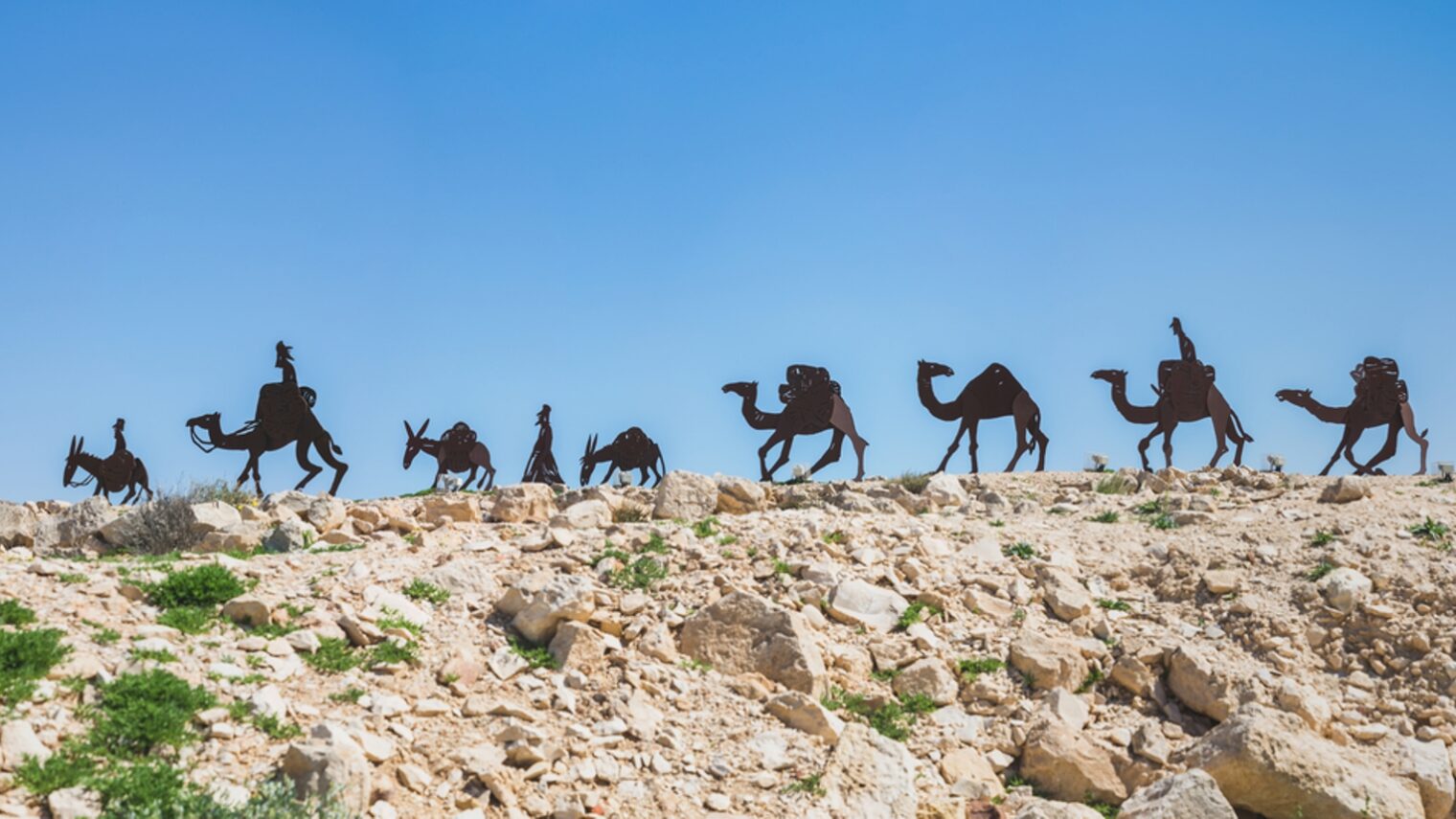Sculpture of camels traversing the Incense Route in Avdat National Park, Israel. Photo by Kate Giryes/Shutterstock.com