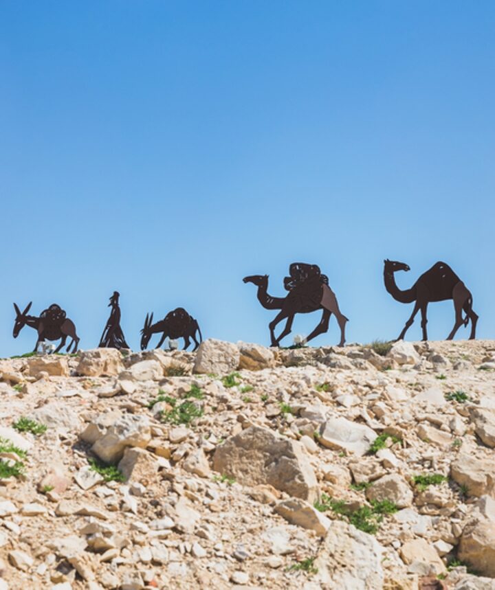 Sculpture of camels traversing the Incense Route in Avdat National Park, Israel. Photo by Kate Giryes/Shutterstock.com
