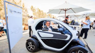 Serge Passolunghi, director of the Renault Innovation Lab in Silicon Valley, sitting in a Renault Twizy at EcoMotion in Tel Aviv. Photo by Shlomi Mizrachi