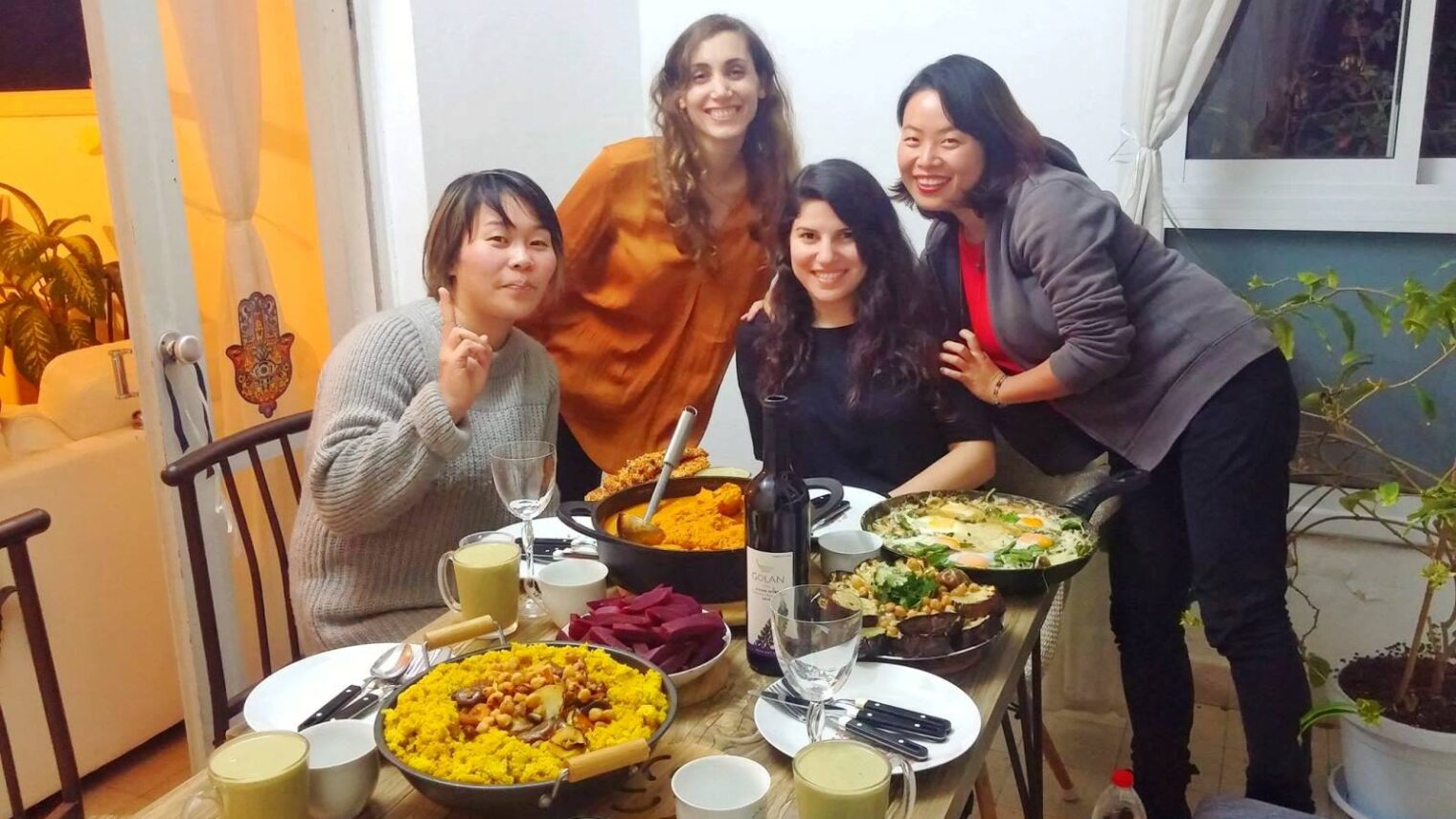 Betzavta hosts and guests sharing a meal in the Tel Aviv area. Photo: courtesy