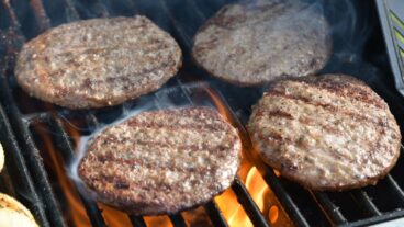 Image of grilled burgers via Shutterstock.com