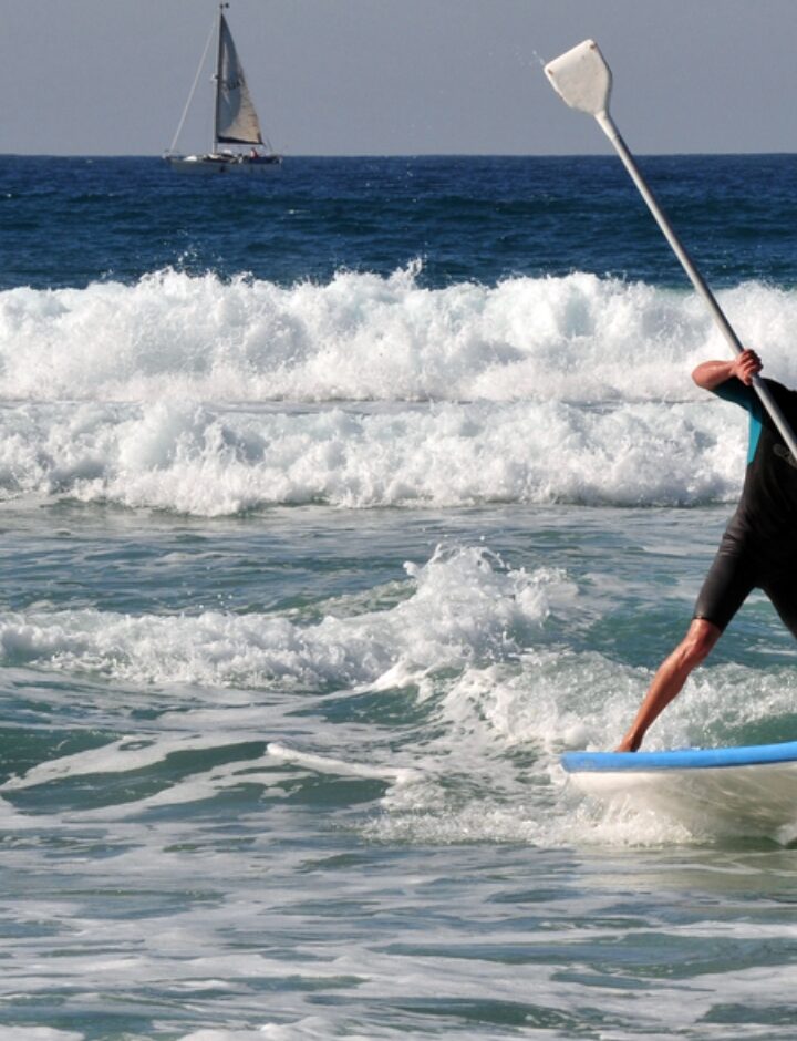 Stand-up paddle surfing in Ashdod on the Mediterranean. Photo by ChameleonsEye/Shutterstock.com
