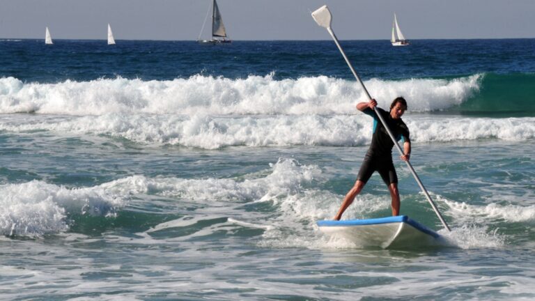 Stand-up paddle surfing in Ashdod on the Mediterranean. Photo by ChameleonsEye/Shutterstock.com