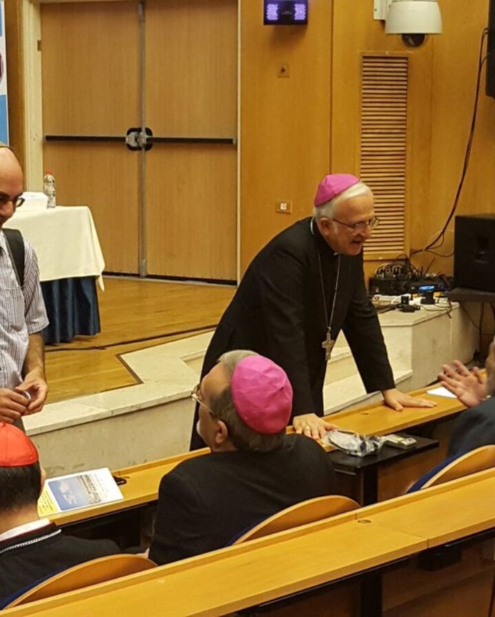 Interfaith Encounter Association Executive Director Yehuda Stolov, left, and Bishop William Shomali of Israel speaking with panelists at the International Forgiveness Conference in Jerusalem. Photo: courtesy