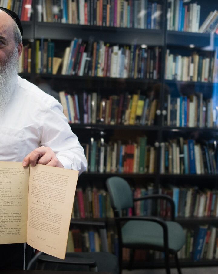 Roni Grosz, director of the Albert Einstein Archives at Hebrew University, showing original documents related to Einstein's prediction of the existence of gravitational waves. Photo by Yonatan Sindel/FLASH90