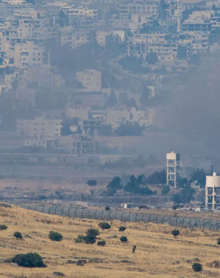 A picture taken from the Israeli side of the border shows smoke rising at a Syrian village near the Israeli-Syrian border in the Golan Heights on June 24, 2017. Photo by Basel Awidat/Flash90