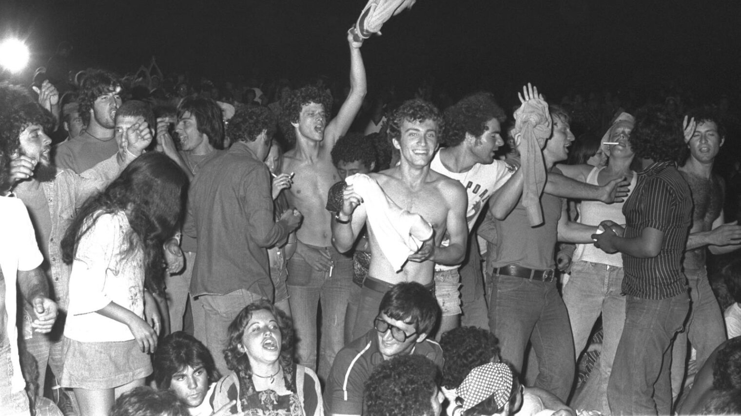 Young Israelis and tourists at a 1977 music festival at Nuweiba. Photo by Moshe Milner/National Photo Collection