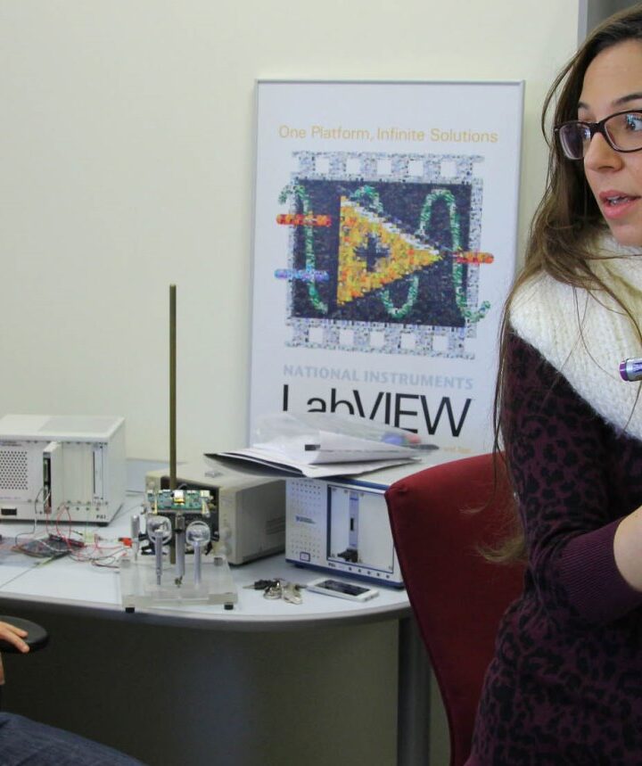 Dr. Oz Levinkron, seated, of the Technion Faculty of Medicine, wears the device that can diagnose diseases based on eyelid motion. At right, lead researcher Adi Hanuka of the Technion. Photo: courtesy