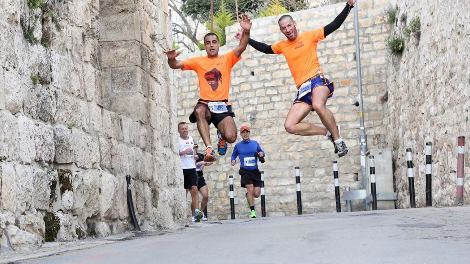 Jerusalem Marathon participants jumping for joy. Photo: courtesy