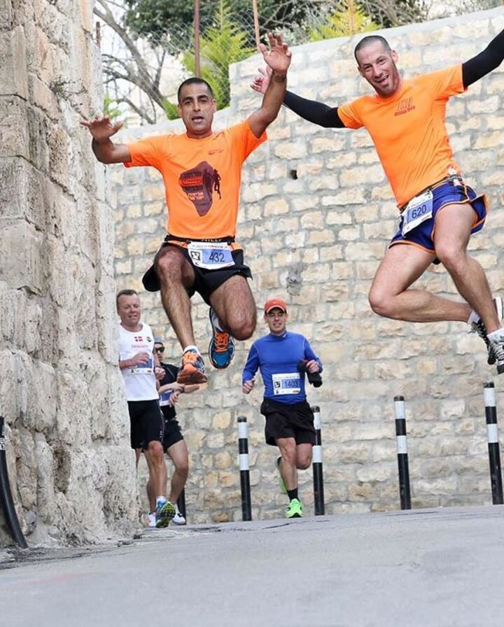 Jerusalem Marathon participants jumping for joy. Photo: courtesy