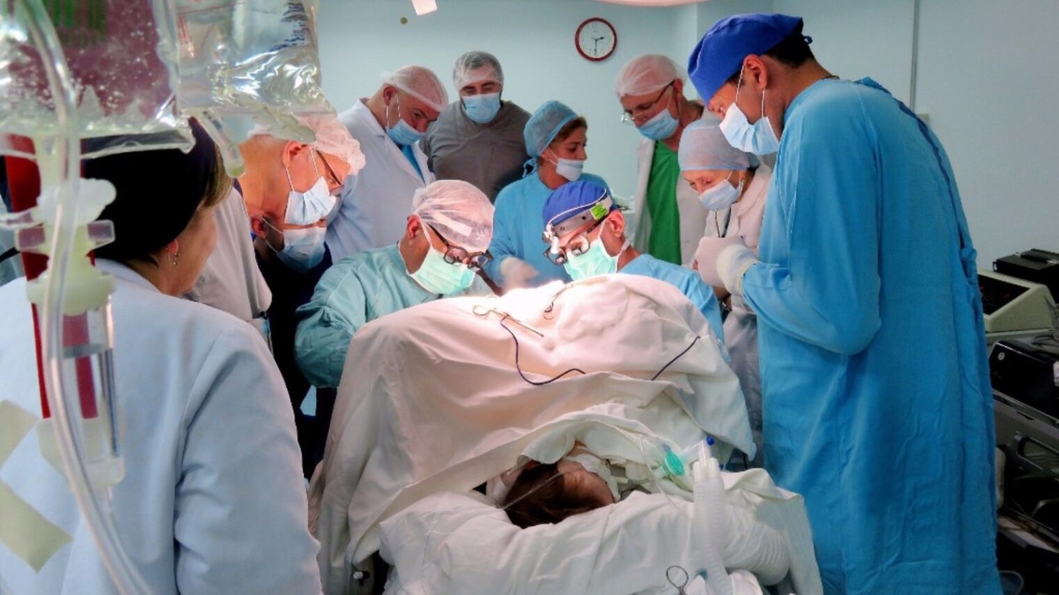 Operating on a patient in Tbilisi are Rambam surgeons Dr. Ran Steinberg, center right, and Tblisi native Dr. Arcadi Vachian. Photo courtesy of Rambam Health Care Campus