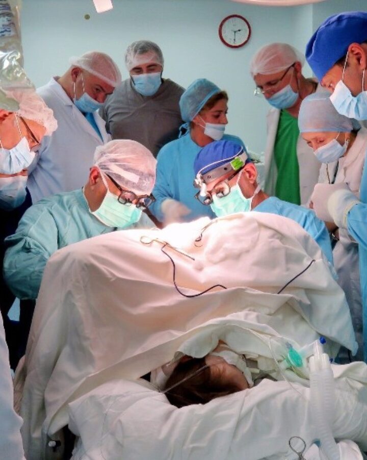 Operating on a patient in Tbilisi are Rambam surgeons Dr. Ran Steinberg, center right, and Tblisi native Dr. Arcadi Vachian. Photo courtesy of Rambam Health Care Campus
