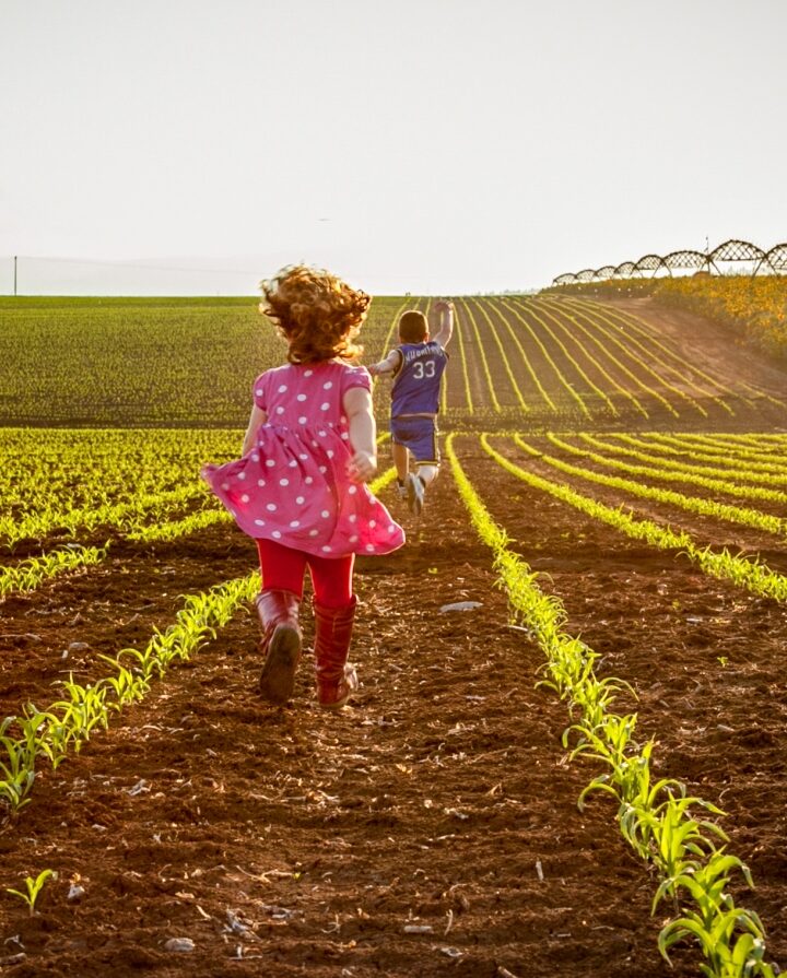 Children running through farm fields in Israel’s Jezreel Valley. Photo by Anat Hermony/FLASH90