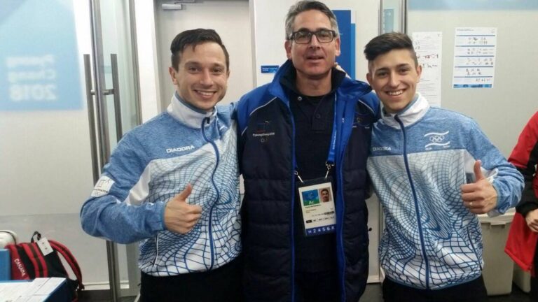 Israeli Olympic figure skaters Alexei Bychenko, left, and Daniel Samohin, right, flank delegation head Yaniv Ashkenazy on Feb. 17 in Pyeongchang. Photo courtesy of Israel Olympic Committee
