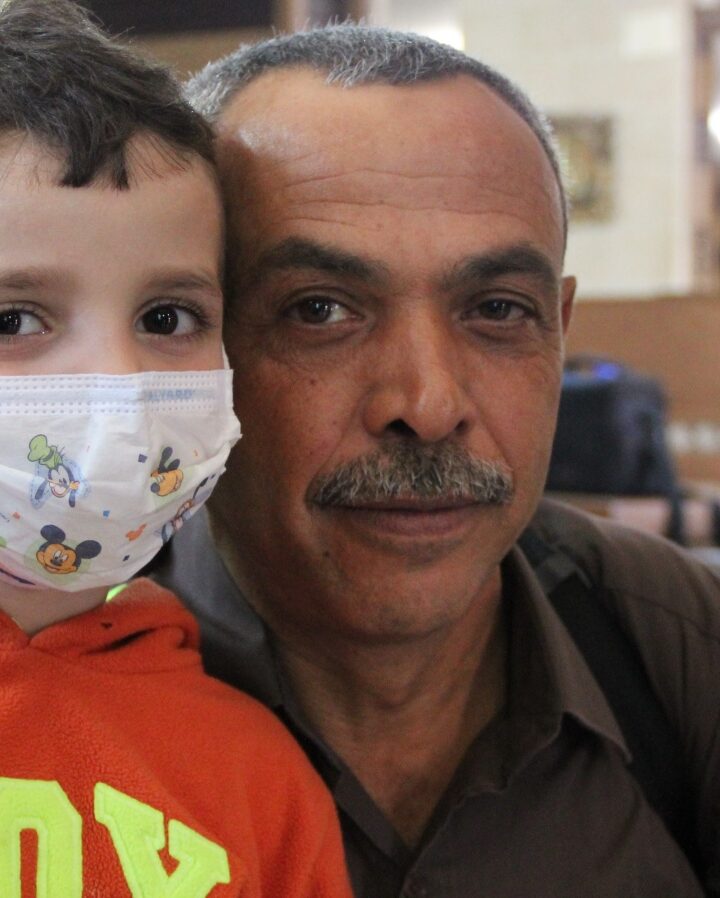 Naeem al-Bayda, West Bank coordinator of transportation for Project Rozana, with a youngster he brought to an Israeli hospital. Photo: courtesy