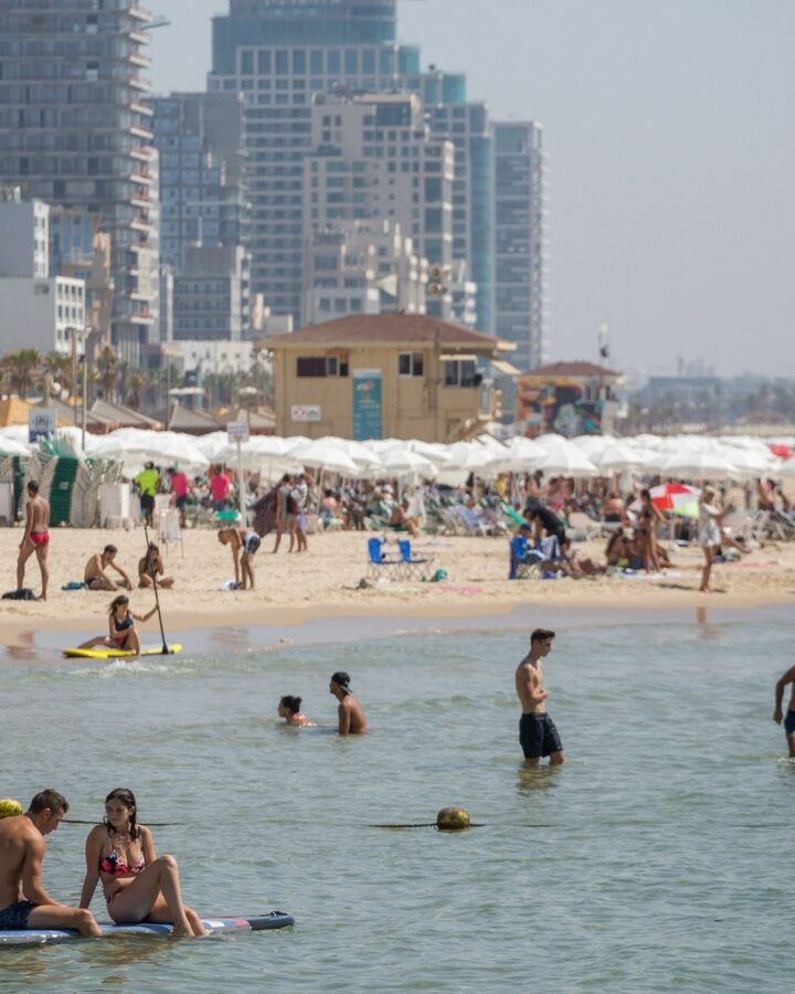 Israelis and tourists enjoy the beach in Tel Aviv on a hot summer day. Photo by Miriam Alster/FLASH90