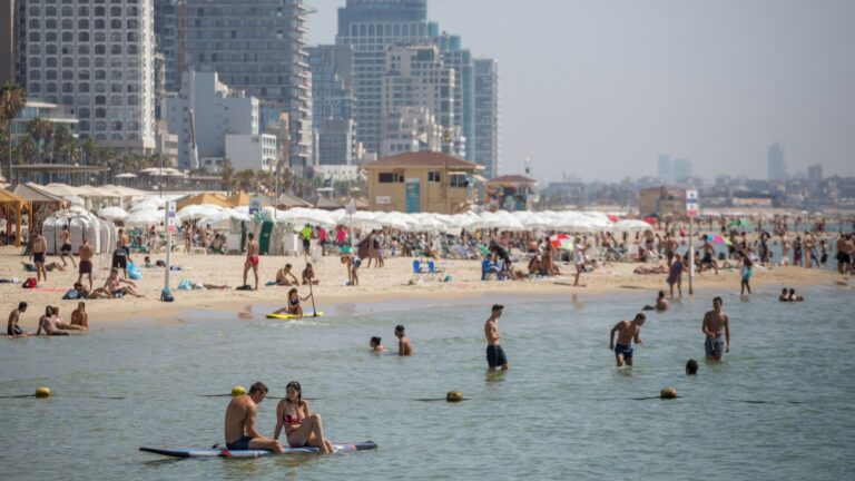 Israelis and tourists enjoy the beach in Tel Aviv on a hot summer day. Photo by Miriam Alster/FLASH90