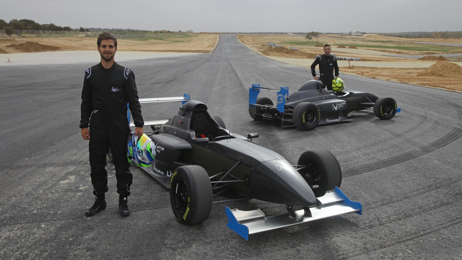 Israeli racecar drivers Yarin Stern, left, and Alon Day on the Motor City track shortly before its completion in spring 2018. Photo by Shahar Algazi