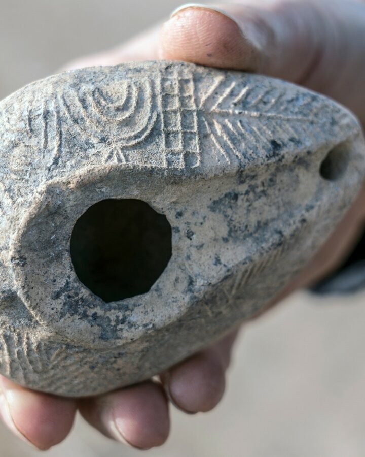 An oil lamp with the seven-branch menorah found in Usha along the Sanhedrin Trail, displayed in the Yigal Allon Center. Photo by Yaniv Berman/Israel Antiquities Authority