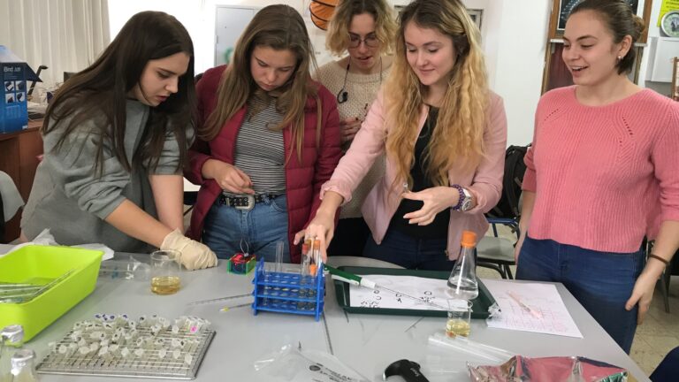 Students at Israel’s Hakfar Hayarok International School preparing bacteria experiments. Photo courtesy of Weizmann Institute of Science