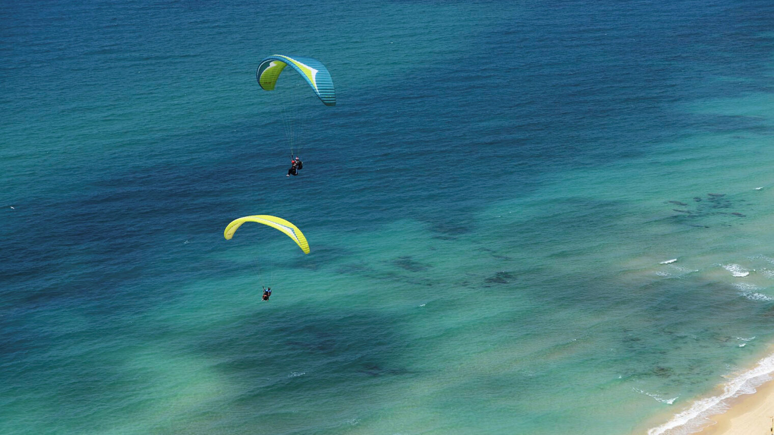 Paragliders sail quietly over the beach in Netanya. Photo by Mendy Hechtman/Flash90