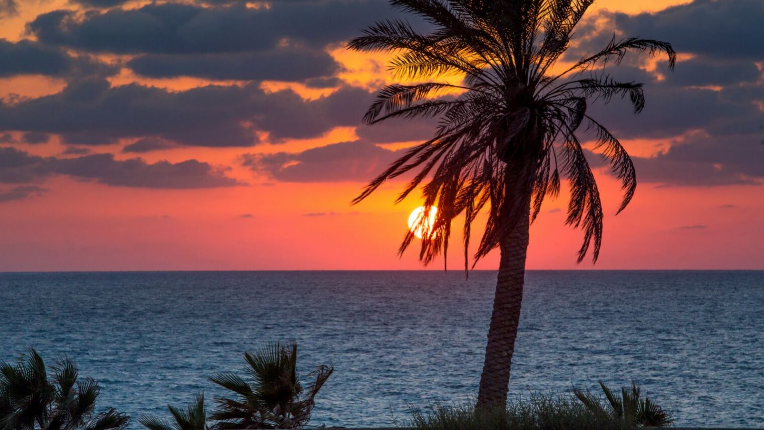 The sun sets over the Mediterranean Sea, as seen from the beach in Ashkelon. Photo by Edi Israel/FLASH90