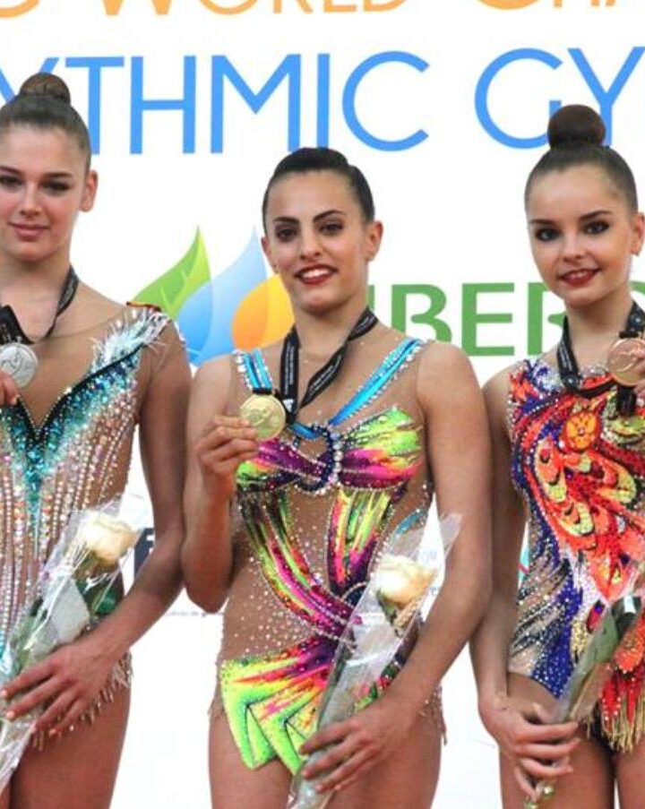 Linoy Ashram, center, with her gold medal at the Rhythmic Gymnastics World Challenge Cup competition in Spain, May 2018. Photo courtesy of Israel Olympic Committee