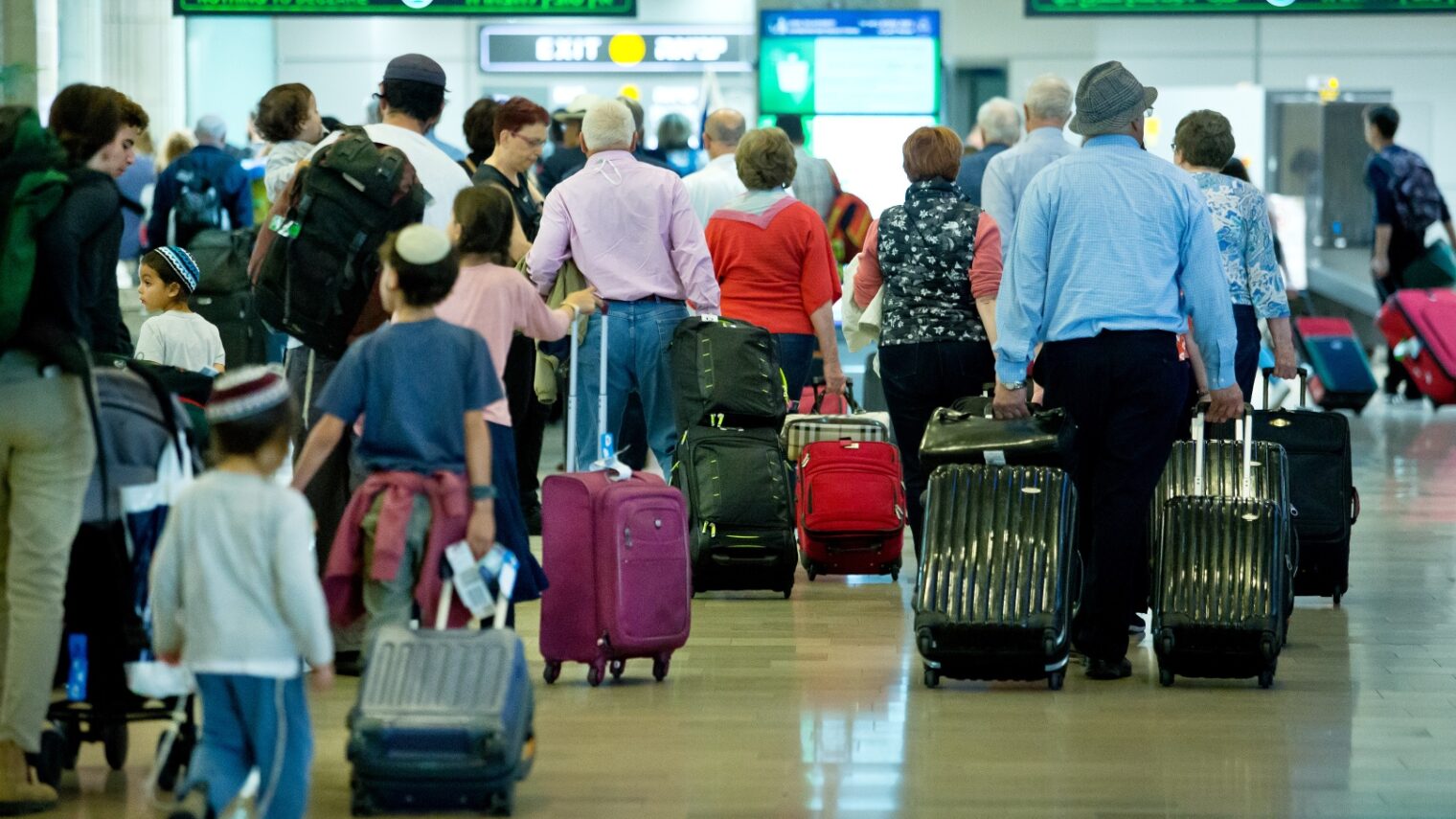 Travelers at Ben-Gurion International Airport. Photo by Moshe Shai/FLASH90