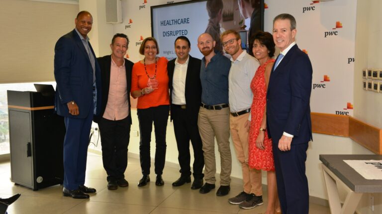 Shown at the Tel Aviv awards event, from left: Wright Lassiter, CEO, Henry Ford Health System; Henry Ford Hospital Chief Surgeon Scott Dulchavsky; Maura Rosenfeld, Chief Business Development Officer, Healthymize; Shady Hassan, CEO, Healthymize; Daniel Aronovich, CTO, Healthymize; Kevin Kotzen, Senior Algorithm Developer, Healthymize; Henry Ford Health System Global Innovation Managing Director Lisa Prasad; and Mark Coticchia, Chief Innovation Officer, Henry Ford Health System. Photo by Oleg Luft/mHealth Israel