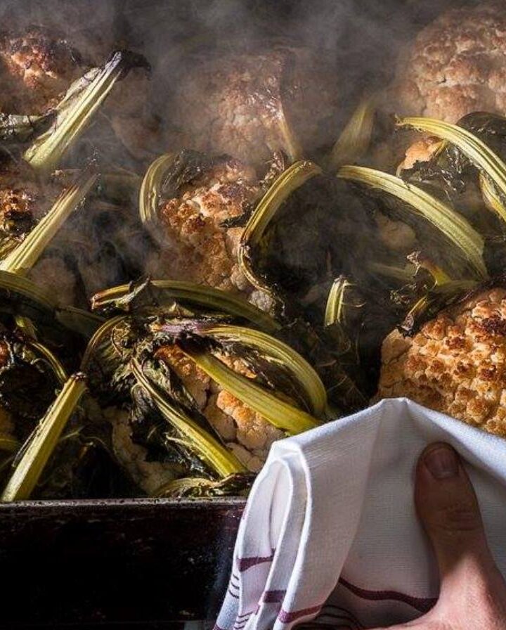 Whole roasted cauliflower is a signature dish at Eyal Shani’s Miznon restaurants. Photo via Facebook