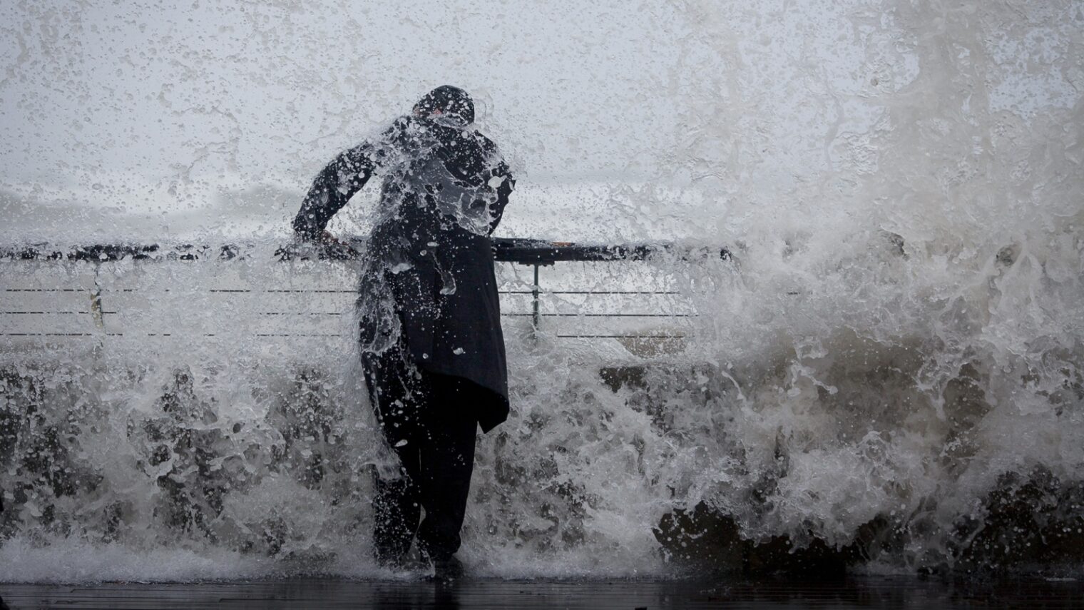 A man is doused by a sudden large wave at Tel Aviv Port in January. Photo by Amir Levy/FLASH90