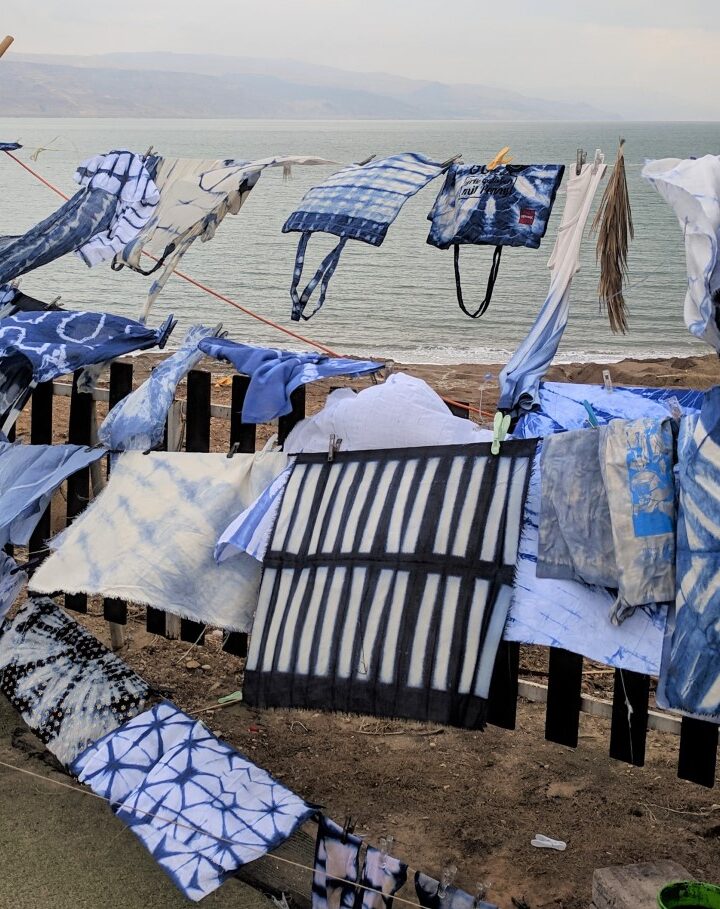After using a traditional Japanese technique to stain textiles with organic dyes, industrial design students hang their projects to dry at Bezalel Academy’s annual Dead Sea Seminar. Photo: courtesy