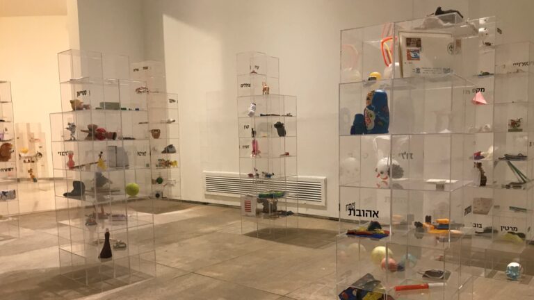 Perspex boxes filled with personal objects personify the city in the Ashdod Project exhibit. Photo by Naama Barak