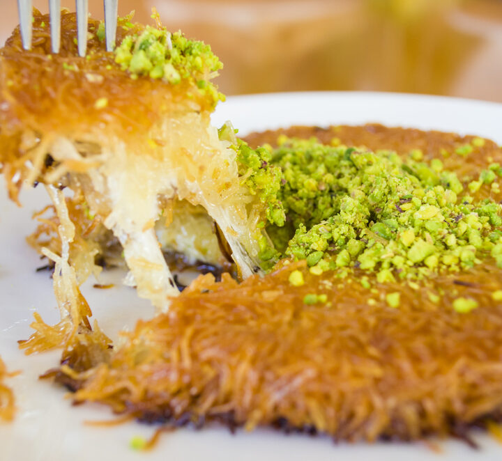 Made from soft cheese, and sprinkled with syrup and pistachio, knafeh today is a popular dessert in Israel. Photo by Shutterstock.