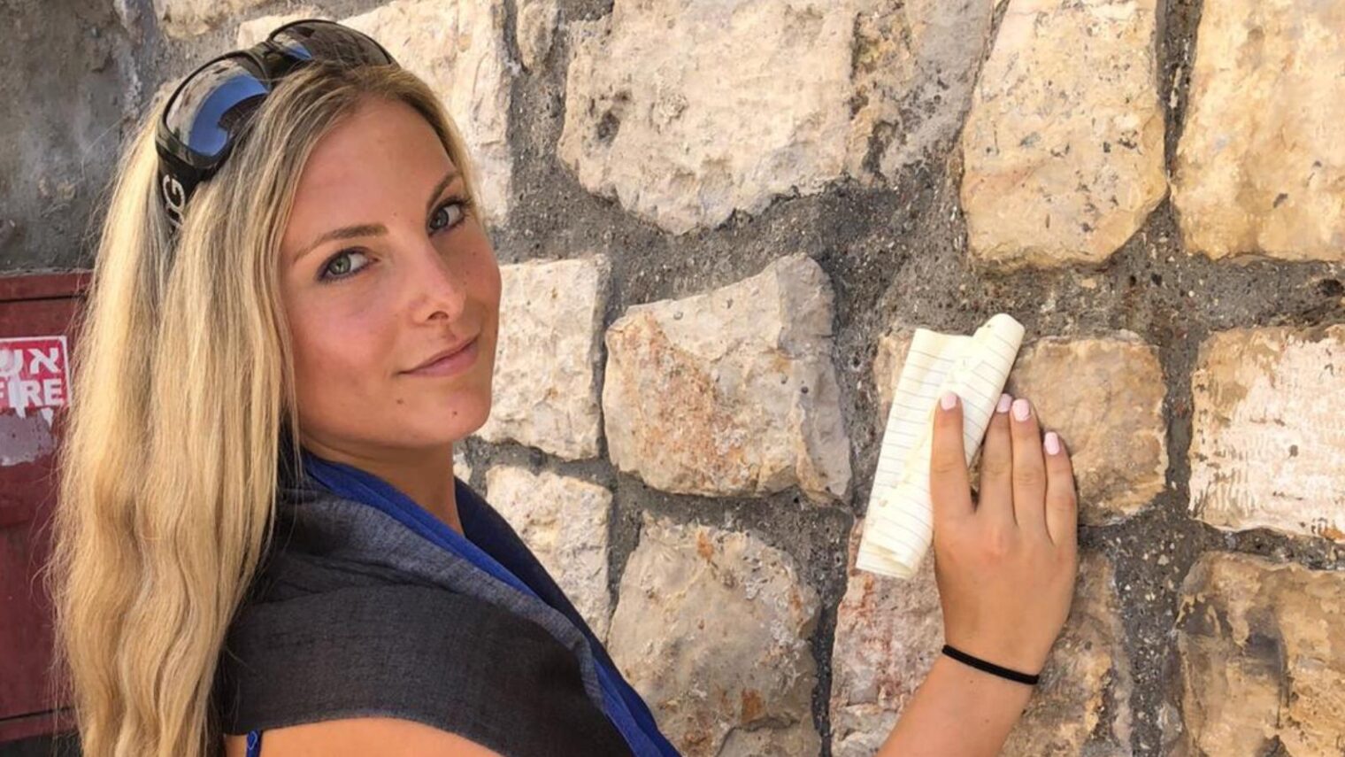 Sharon Burke placing a note in the Western Wall. Photo: courtesy
