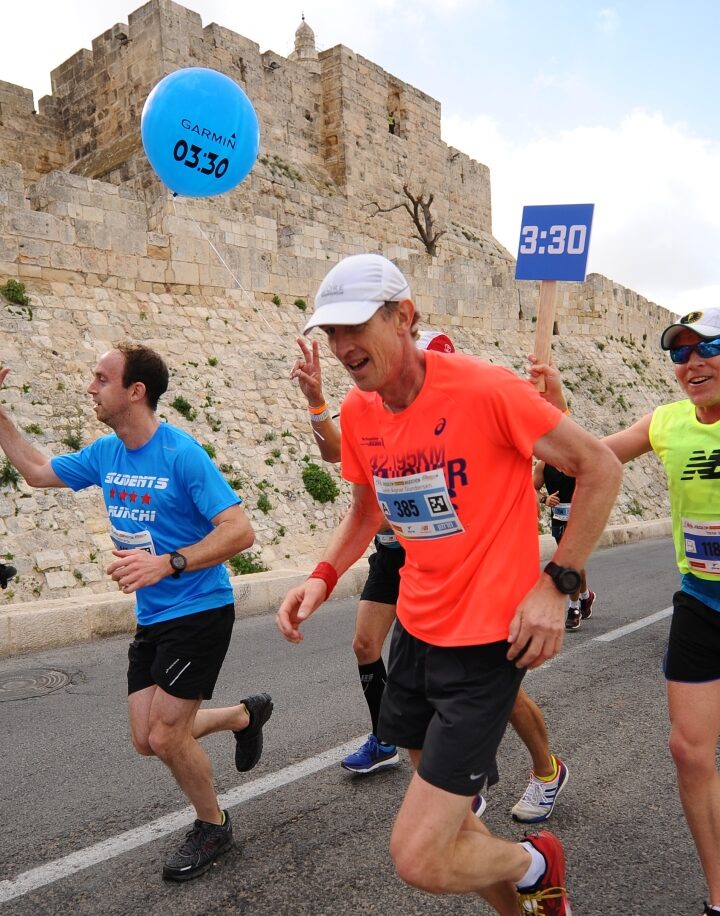 Runners in the 2018 international Jerusalem Marathon pass by Jaffa Gate. Photo by Mendy Hechtman/FLASH90