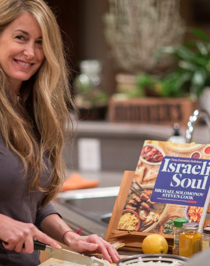 Rachel Koch cooking up recipes from the cookbook she won from ISRAEL21c. Photo by Dr. Jack L. Koch