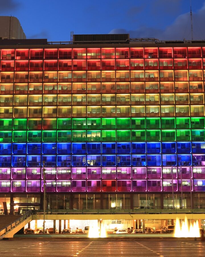 Rainbow flag lighting over Tel Aviv City Hall. Photo by Mordechai Meiri via shutterstock.com