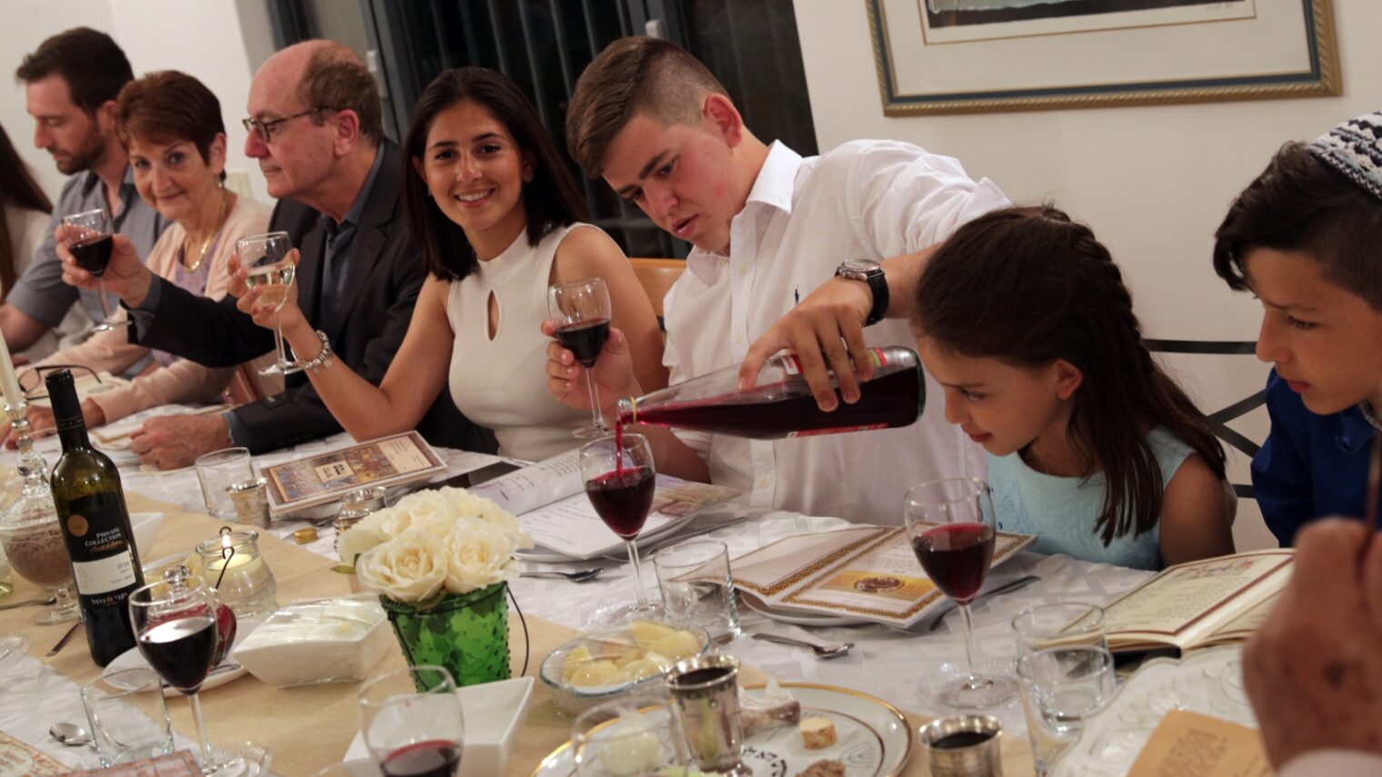 An Israeli family around the Seder table. Photo by Nati Shohat/FLASH90
