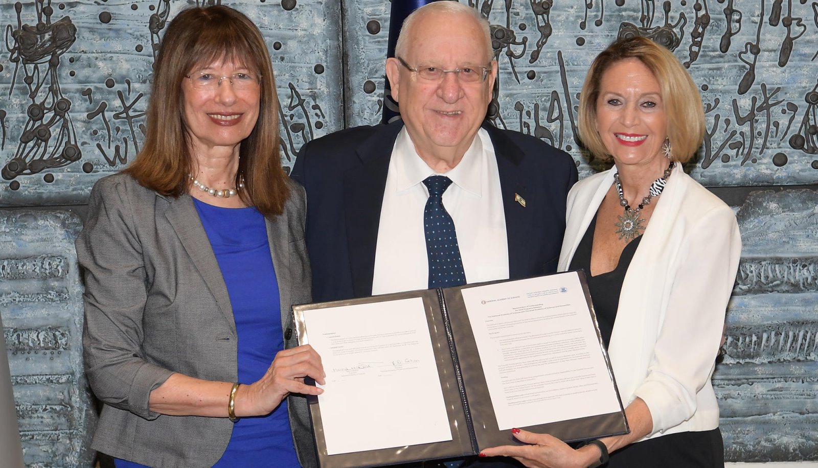 Prof. Nili Cohen, left, President Reuven Rivlin and Prof. Marcia McNutt sign the science academies cooperation agreement in Jerusalem on April 7, 2019. Photo by Amos Ben Gershom/GPO