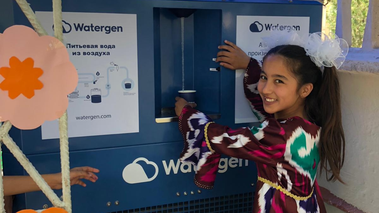 A child in Bukhara using the Watergen GEN-350 atmospheric water generator. Photo: courtesy